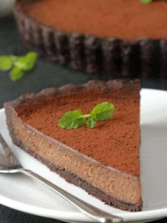 Mint Chocolate Tart has a creamy chocolate filling and homemade chocolate cookie crust. So delicious. Recipe includes a gluten-free option.