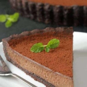 Mint Chocolate Tart has a creamy chocolate filling and homemade chocolate cookie crust. So delicious. Recipe includes a gluten-free option.