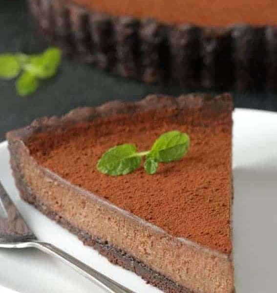 Mint Chocolate Tart has a creamy chocolate filling and homemade chocolate cookie crust. So delicious. Recipe includes a gluten-free option.