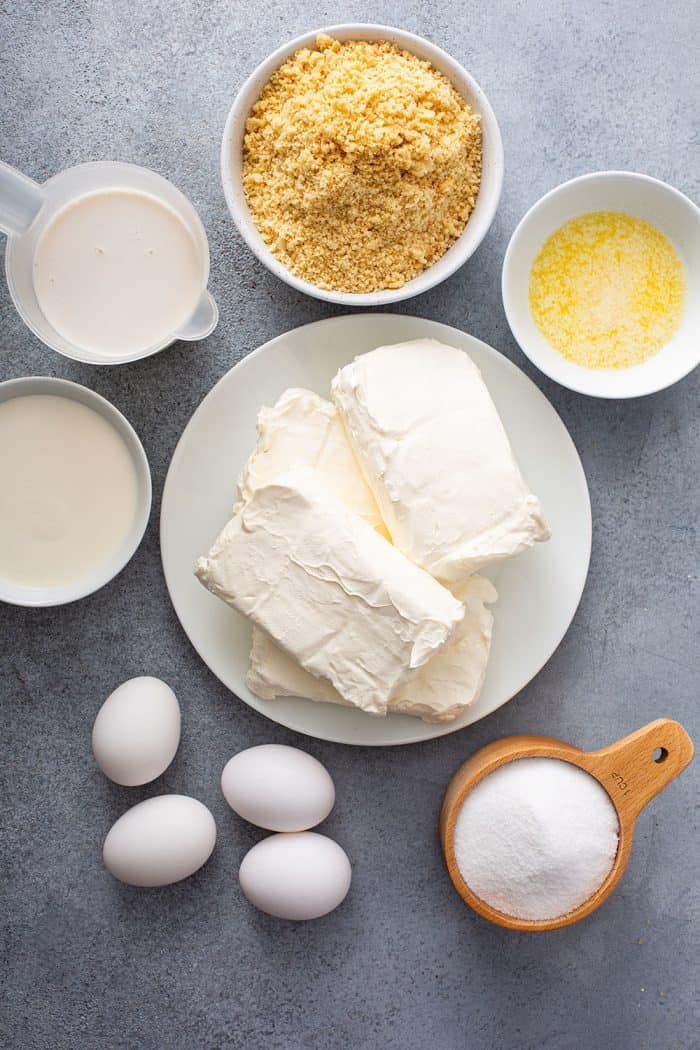 Ingredients for sugar cookie cheesecake arranged on a countertop