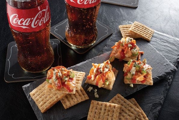 Buffalo Chicken Salad is the perfect game-day bite when teamed up with TRISCUIT Crackers and an ice cold bottle of Coca-Cola®. 