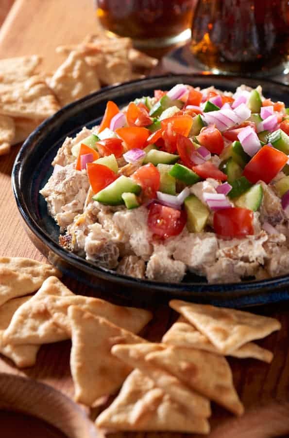 Score big by bringing this Chicken Shawarma Dip, served with WHEAT THINS Toasted Pita Original Oven Baked Crackers.