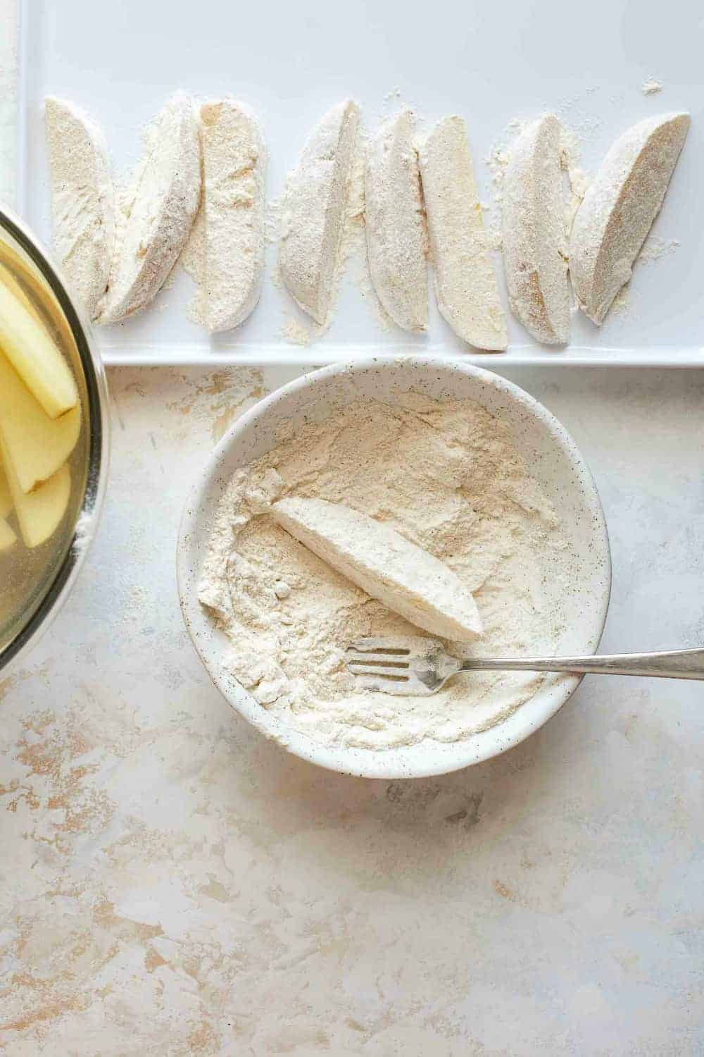 Potato wedges dredged in seasoned flour