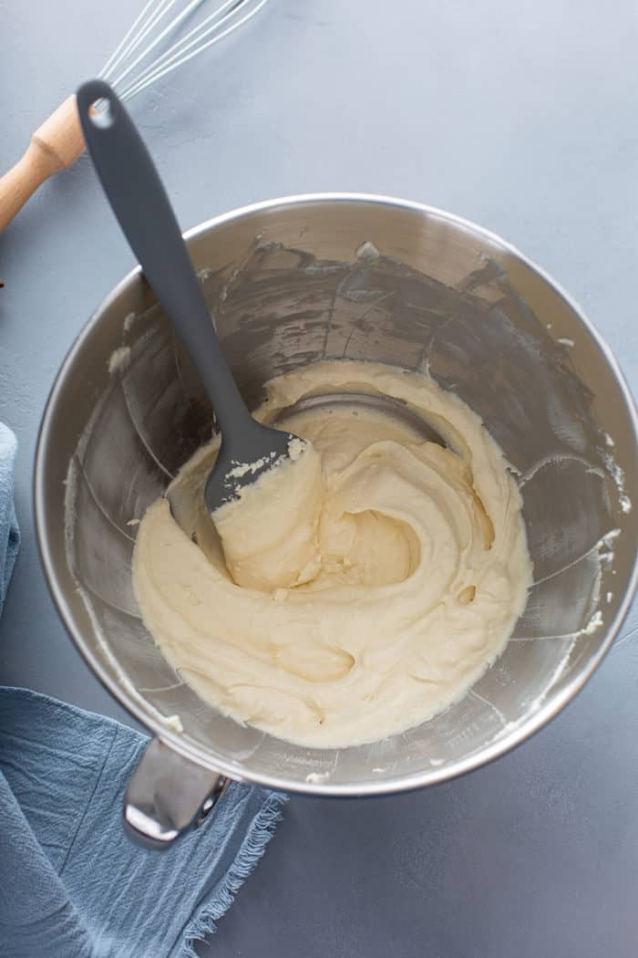 Cream cheese and butter mixed together in a metal mixing bowl
