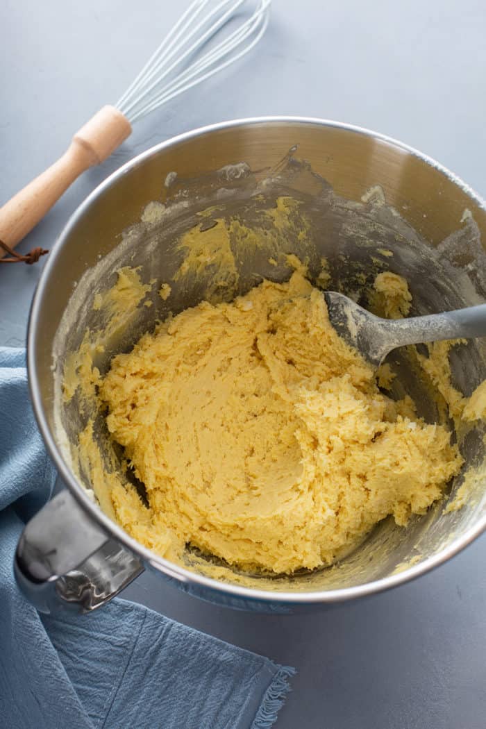 Gooey butter cookie dough in a metal mixing bowl