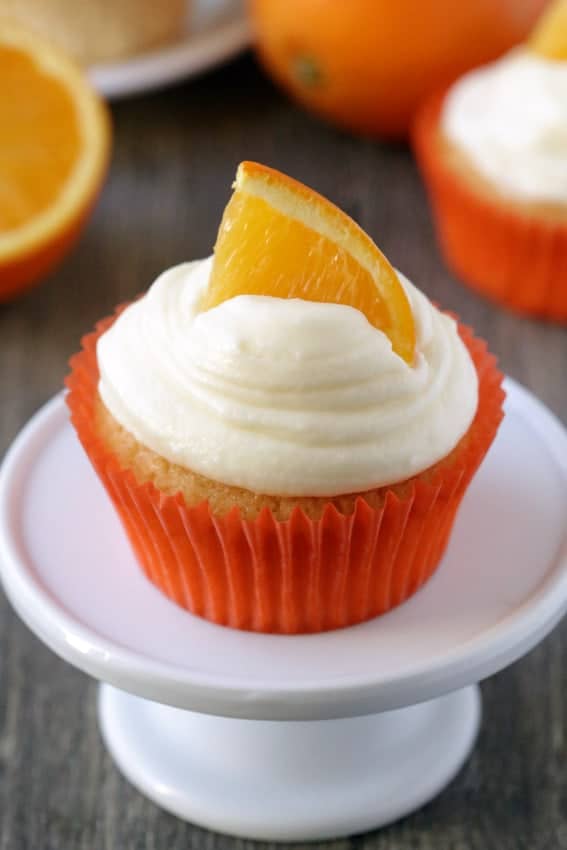 Orange Creamsicle Cupcakes are loaded with orange flavor and  topped with a swirl of cream cheese frosting. Recipe contains a gluten-free option.