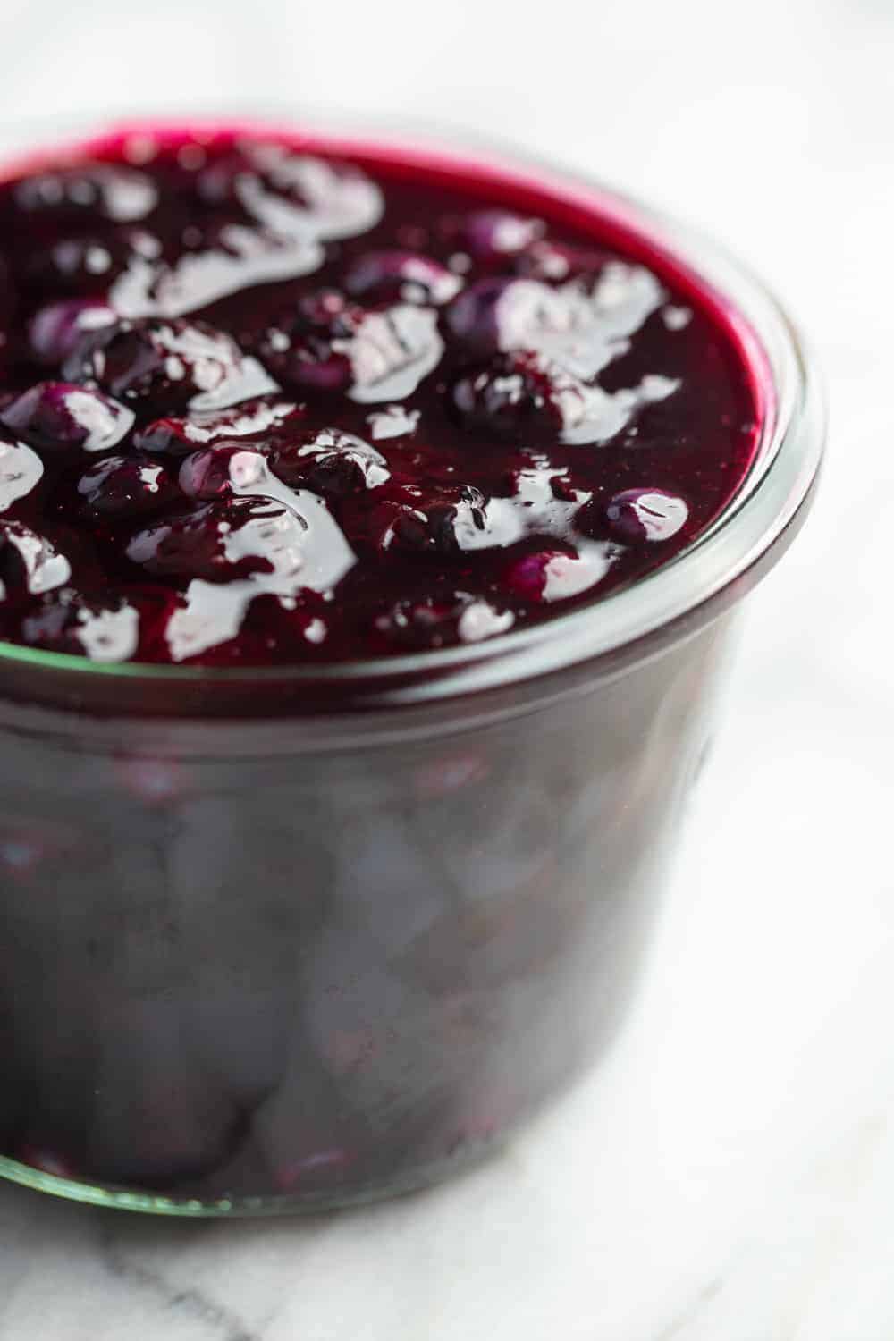 Homemade blueberry sauce in a glass jar