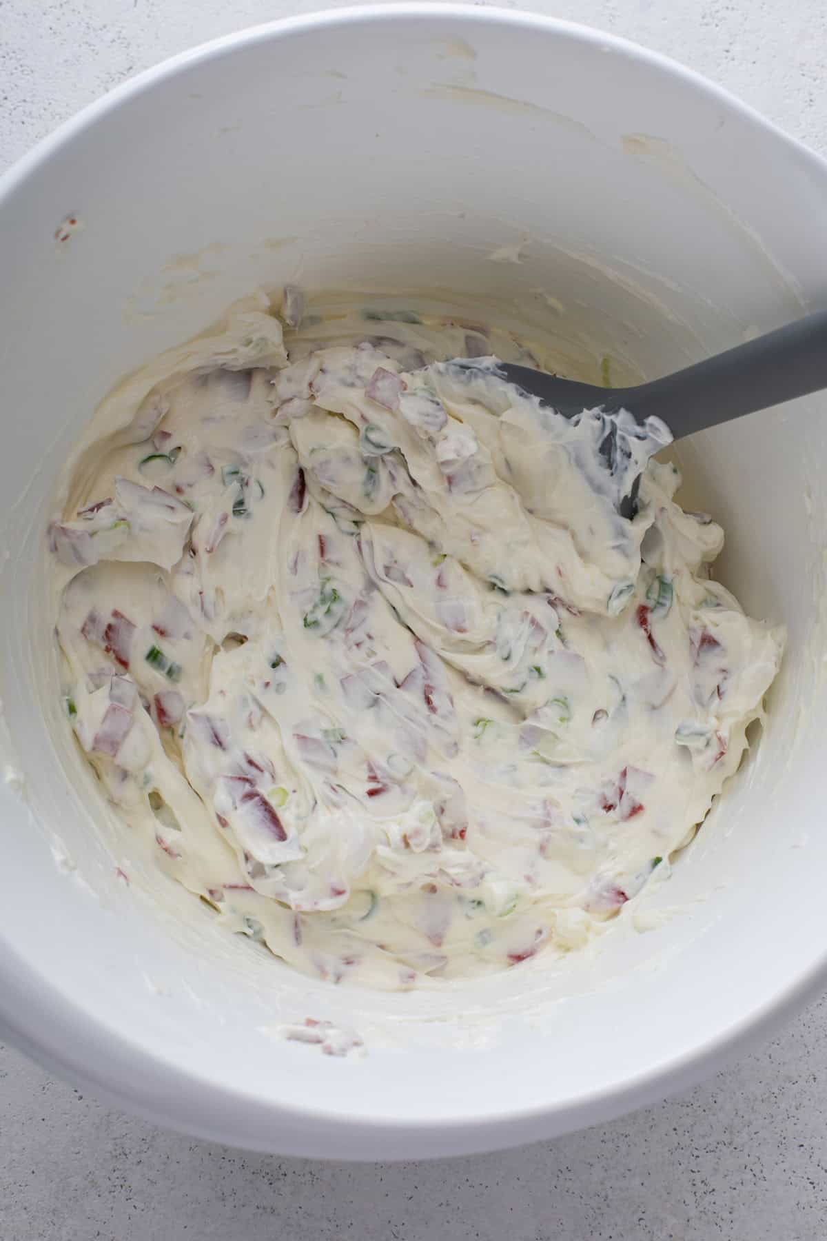 Dried beef dip mixed in a white bowl.