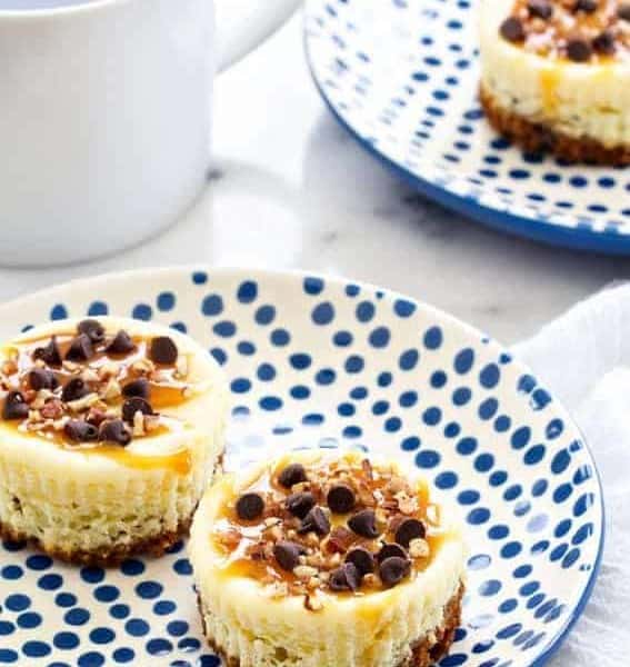 Turtle Cheesecake Cookie Cups are bite sized indulgences. You won't be able to stop at one!