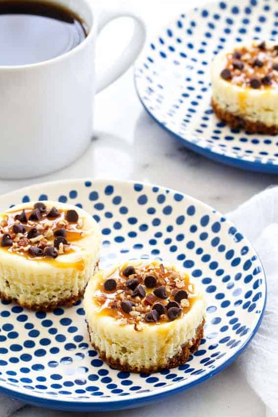 Turtle Cheesecake Cookie Cups are bite sized indulgences. You won't be able to stop at one!