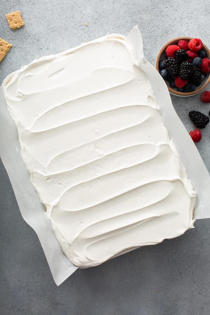 Assembled lemon icebox cake in a white cake pan, ready to chill