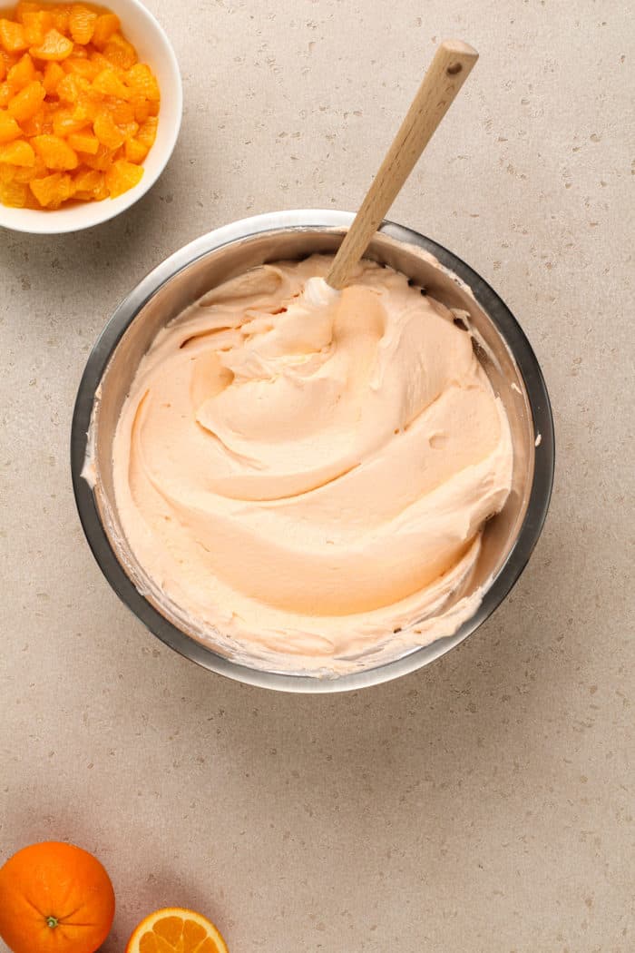 Base for orange fluff in a metal mixing bowl.