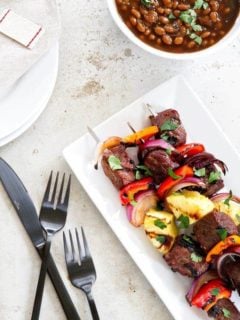 Sweet and Spicy Beef Kebabs are a delicious twist on traditional kebabs. Loaded with bell peppers, red onion, and pineapple - you'll be craving them all summer long!