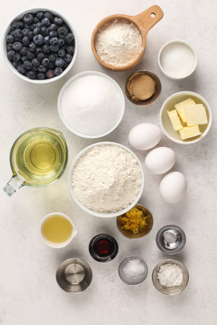 Ingredients for blueberry coffee cake arranged on a countertop.