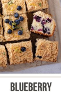 Overhead shot of a sliced blueberry coffee cake set on a piece of parchment paper. Text overlay includes recipe name.