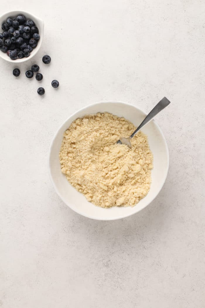 Streusel for coffee cake in a white ceramic bowl.