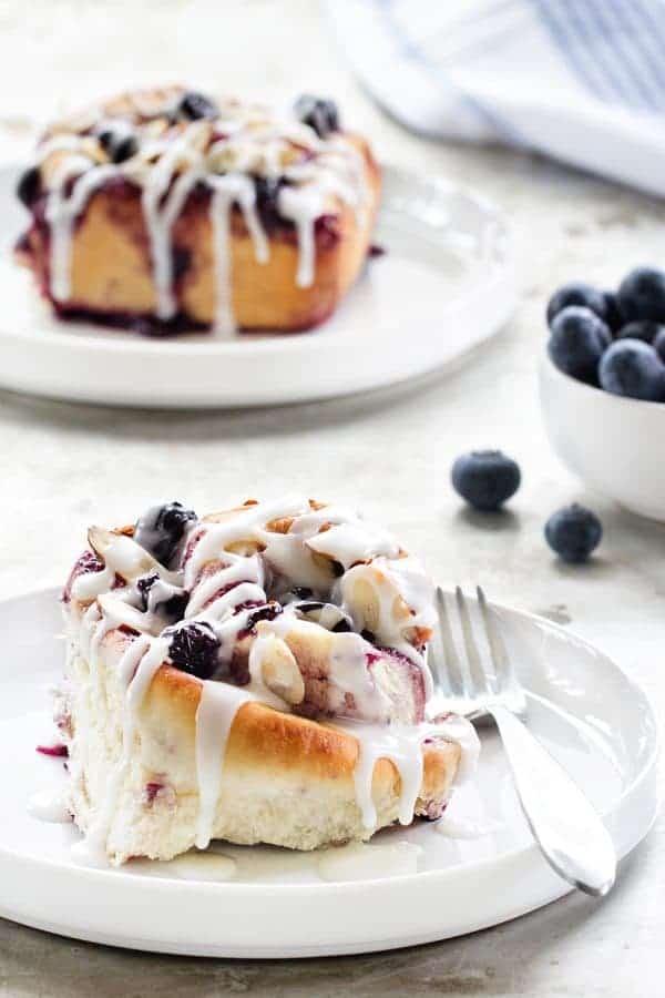 Blueberry Sweet Rolls have blueberries throughout. Topped with a vanilla frosting, you'll have one unforgetable treat!