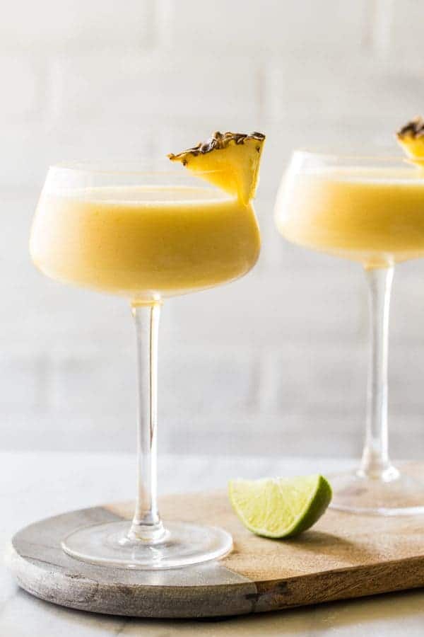 Frozen Pineapple Mango Daiquiris are going to be your new favorite cocktail for summer. Smooth, cool, and oh, so delicious! 