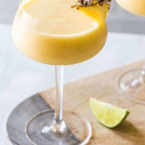 Frozen Pineapple Mango Daiquiris are the ultimate hot weather cocktail: smooth, cold, fruity and not-too-sweet. So amazing for summer.