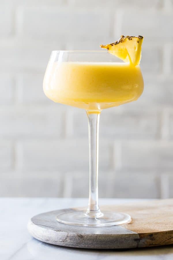 Frozen Pineapple Mango Daiquiris are so perfect for summer. Cool, smooth, and totally delicious! 
