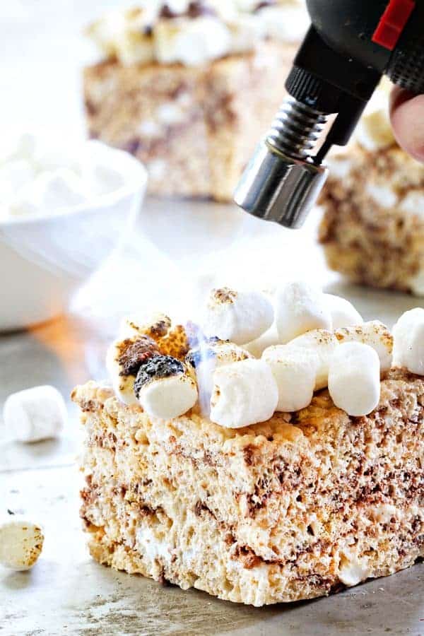 S'mores Marshmallow Crispy Treats have toasted marshmallows right on top. Irresisitible!