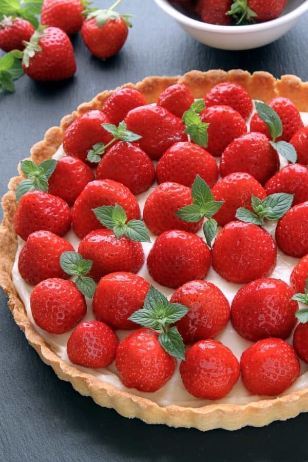 This Strawberry Cream Cheese Tart is loaded with fresh strawberries and a delicious and sweet layer of cream cheese. Perfect for summer!