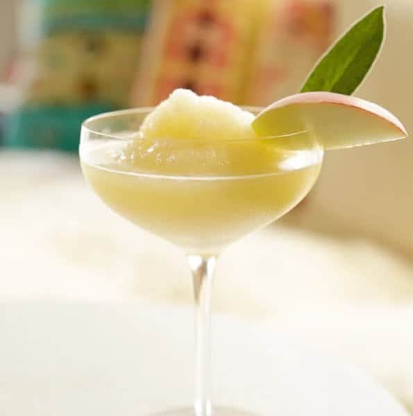 A white wine slushy is the perfect way to beat the summer heat. Loaded with fresh peaches and sweet Moscato, this slushy is going to be your new favorite summer beverage. So refreshing.