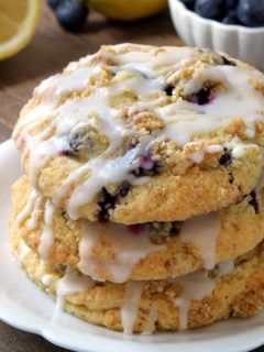 Blueberry Muffin Top Cookies are covered in streusel and drizzled with a lemon glaze. They're perfect for breakfast, dessert, or a midday snack. Recipe contains a gluten-free option.