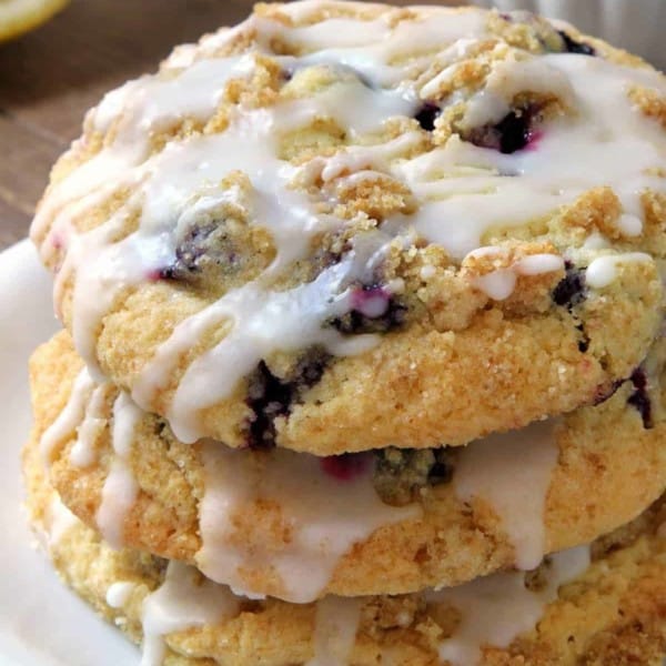 Blueberry Muffin Top Cookies are covered in streusel and drizzled with a lemon glaze. They're perfect for breakfast, dessert, or a midday snack. Recipe contains a gluten-free option.