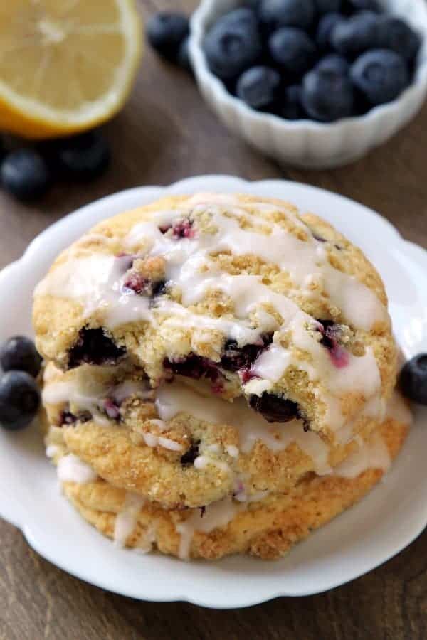 Blueberry Muffin Top Cookies are topped with streusel and a sweet and tart lemon glaze. They're great  for breakfast, dessert, or a midday snack. Recipe contains a gluten-free option.