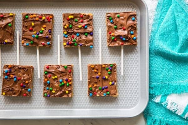 Chocolate Scotcheroos combine creamy peanut butter, rice cereal, and chocolate into one simple and delicious treat. The perfect back-to-school snack!