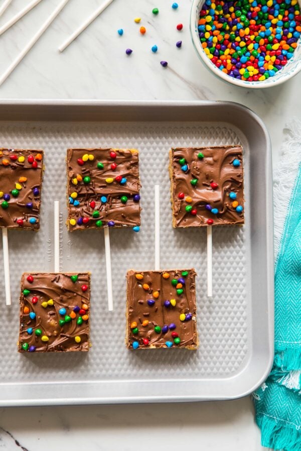 Chocolate Scotcheroos combine peanut butter, rice cereal, and chocolate into one simple and delicious treat. A perfect recipe to make with your kiddos!