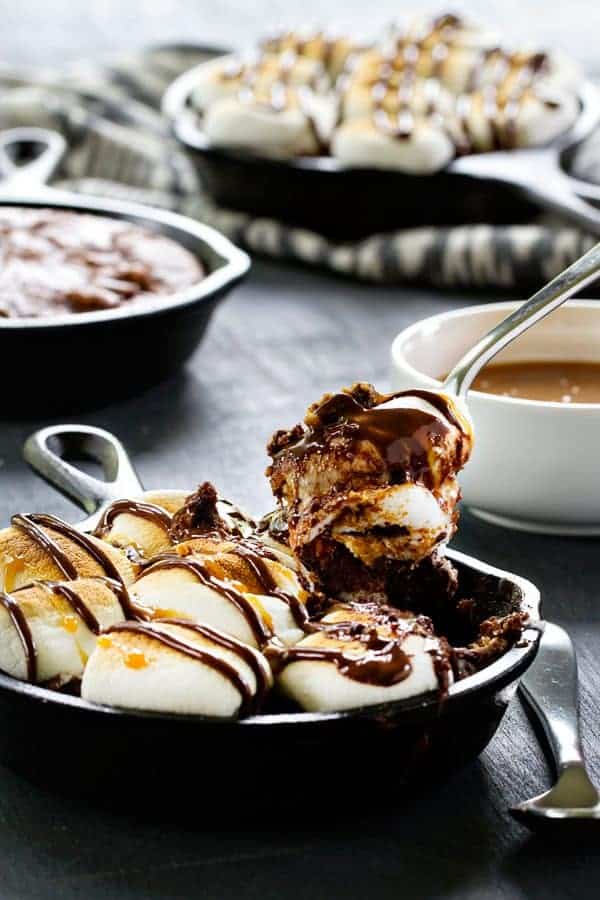 S'mores Skillet Brownies take your favorite treat and marry them with fudgy brownies. You won't be able to resist these!