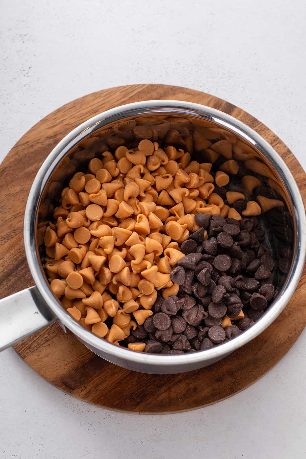 Butterscotch chips and chocolate chips in a small saucepan.