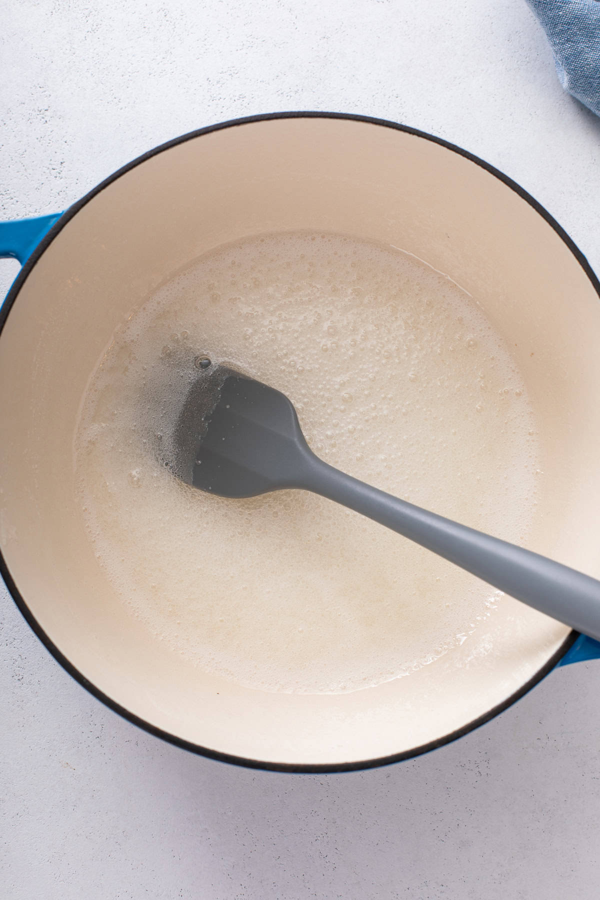 Sugar and corn syrup cooking in a large saucepan.