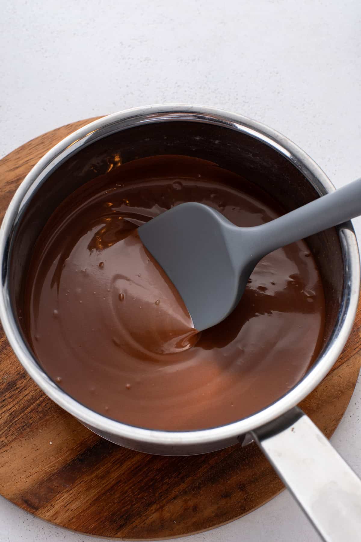 Melted butterscotch and chocolate chips in a saucepan.