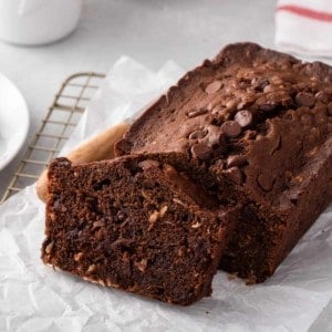 One slice cut from the end of a loaf of chocolate zucchini bread.