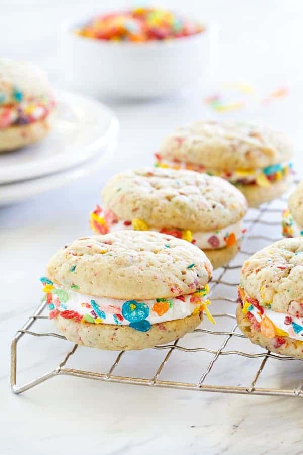Fruity Pebbles Whoopie Pies are a playful and fruity spin on a classic dessert. Marshmallow buttercream and Fruity Pebbles "sprinkles" make them irresistible.