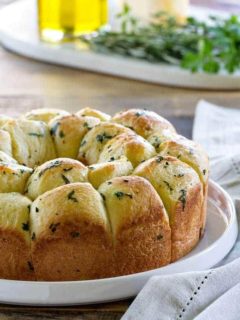 Garlic Parmesan Pull-Apart Bread is great for serving next to turkey and stuffing or spaghetti and meatballs. It's a crowd pleaser, that's for sure!