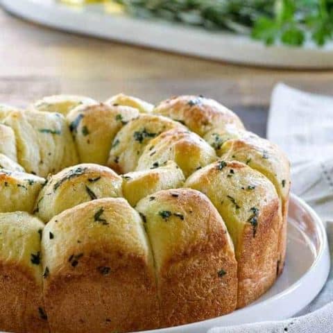 Garlic Parmesan Pull-Apart Bread is great for serving next to turkey and stuffing or spaghetti and meatballs. It's a crowd pleaser, that's for sure!