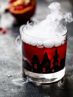 Pomegranate Ginger Punch is the perfect cocktail for an adult Halloween party. Sweet, tart, and just the right amount of kick!
