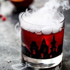 Pomegranate Ginger Punch is the perfect cocktail for an adult Halloween party. Sweet, tart, and just the right amount of kick!