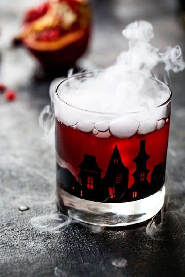 Pomegranate Ginger Punch is the perfect cocktail for an adult Halloween party. Sweet, tart, and just the right amount of kick!