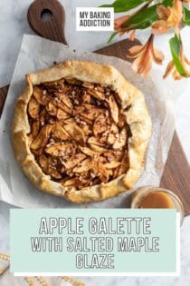 Baked apple galette set on a wooden cutting board next to a glass jar of salted maple glaze. Text overlay includes recipe name.