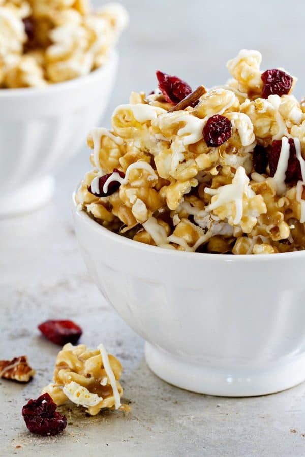 Maple Caramel Corn is brimming with maple marshmallows, chopped pecans, dried cranberries, and a decadent drizzle of white chocolate. So good!