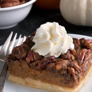 Pumpkin pecan pie bars have a homemade sugar cookie crust, pumpkin filling and a pecan streusel topping. Recipe contains a gluten-free option. These are perfect for Thanksgiving!