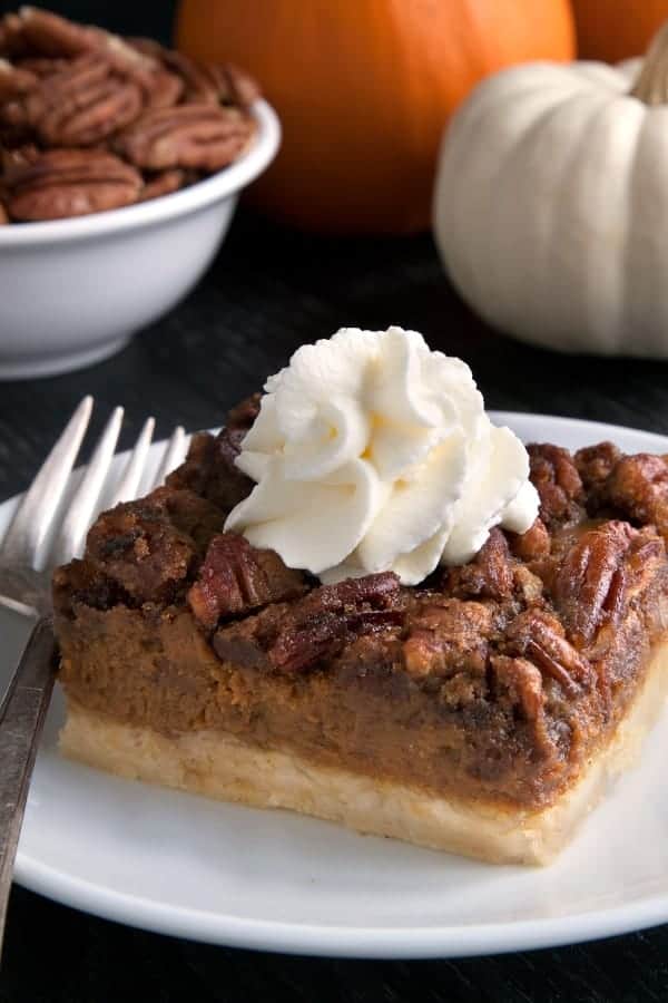 Pumpkin pecan pie bars have a homemade sugar cookie crust, pumpkin filling and a pecan streusel topping. Recipe contains a gluten-free option. These are perfect for Thanksgiving! 