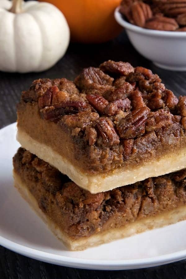 Pumpkin pecan pie bars have a homemade sugar cookie crust, pumpkin filling and a pecan streusel topping. With a gluten-free option. Perfect for the holidays!