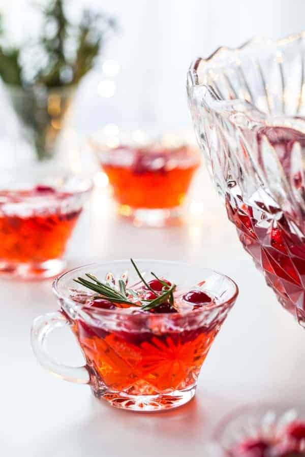 Sparkling Cranberry Rosemary Punch will elevate your holiday party to something truly special. Enjoy its herbacious flavor with your favorite appetizers.