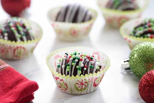 Chocolate Covered Peanut Butter Balls make a festive treat that transports easily to all your holiday parties. They also make amazing homemade gifts!